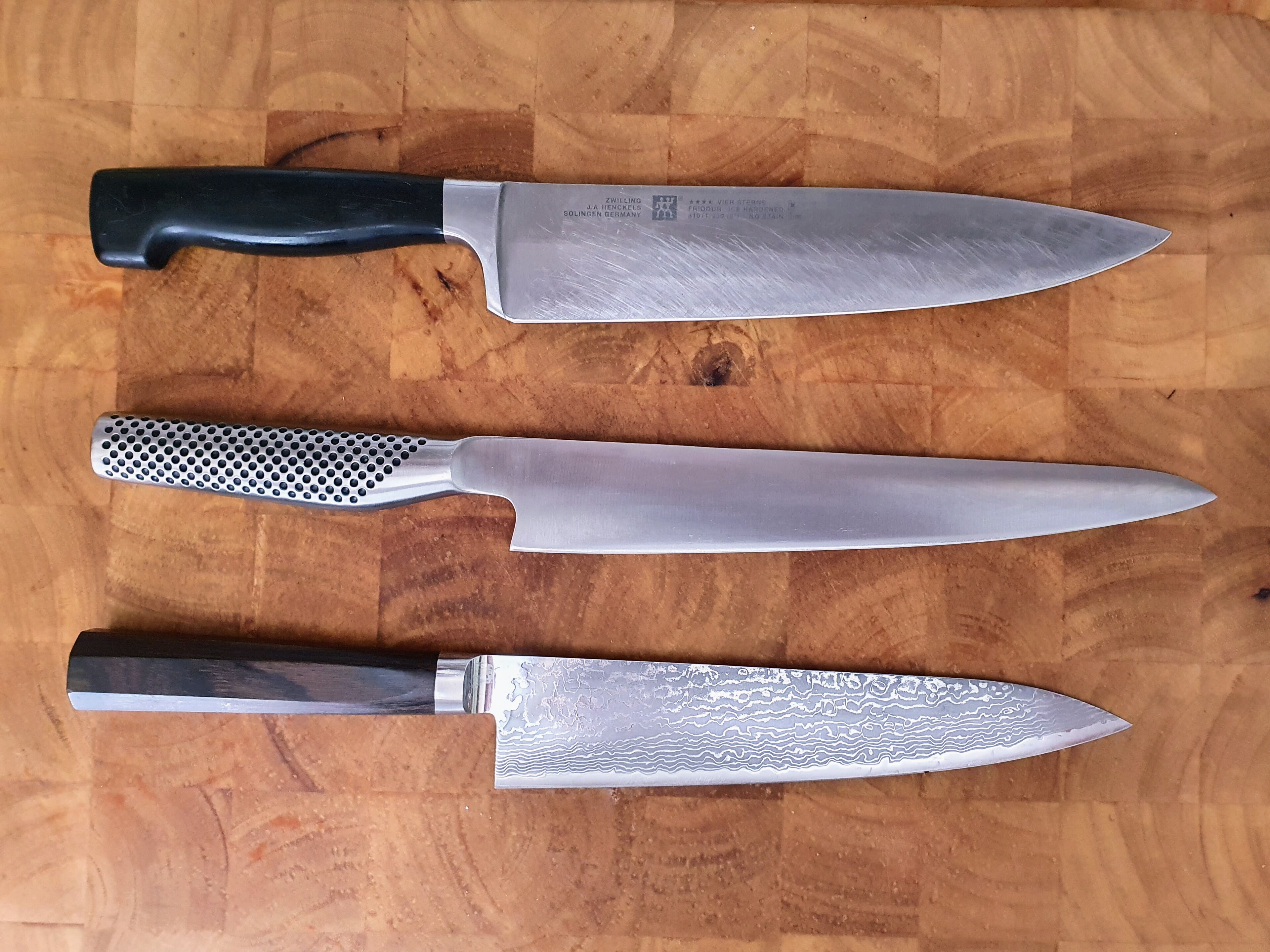 Chef knives on wooden board
