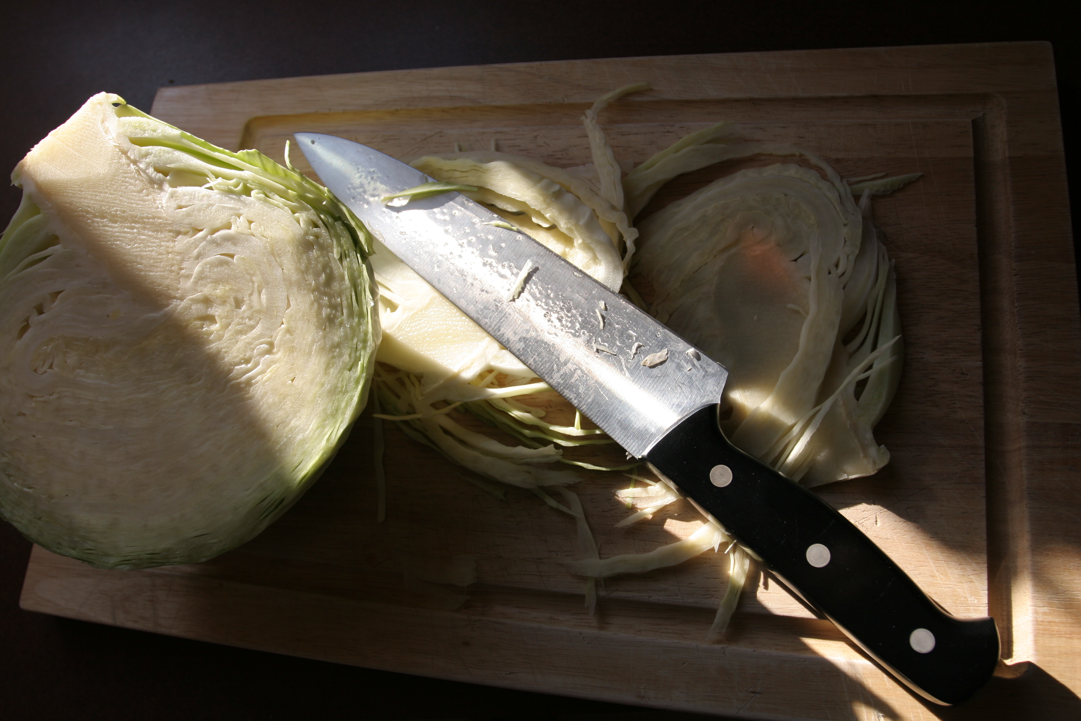 Kitchen knife with sliced cabbage